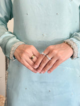 Aqua Silk Sharara Set by MONA featuring a three-piece outfit with intricate detailing and flowing silhouette.